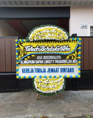 Papan Bunga Duka di Bello